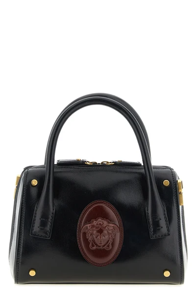 the versace roomy small handbag is made of fine smooth calf leather