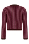 versaces wool knit cardigan defines a new sartorial aesthetic through meticulou