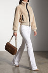 the pinko jacket redefines winter volumes through a structured crop silhouette