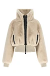 the pinko jacket redefines winter volumes through a structured crop silhouette