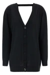the pure wool cardigan nude redefines the codes of knitwear through a fluid and