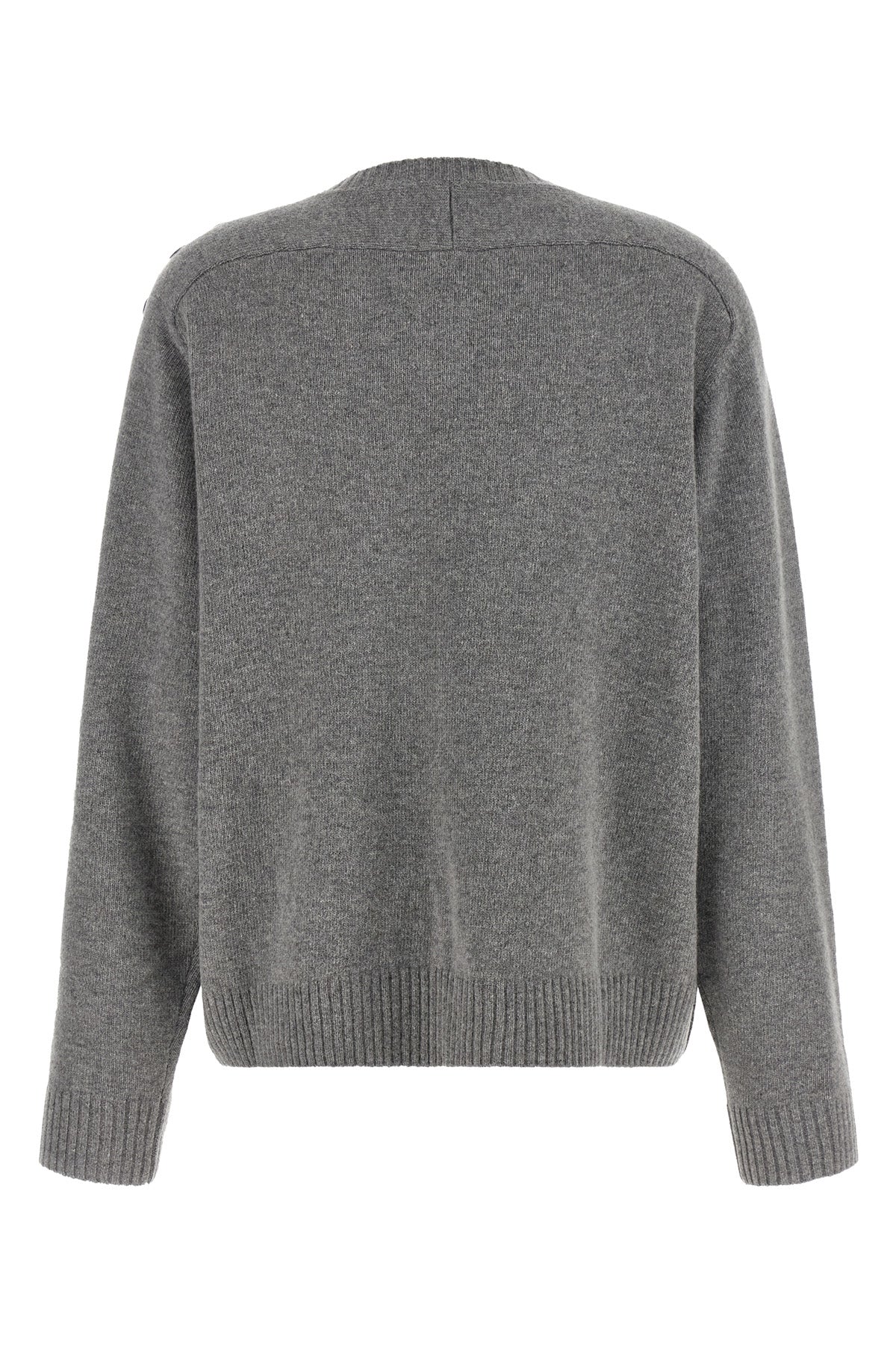 the nude knit redefines the elegance of knitwear through a bold material contras