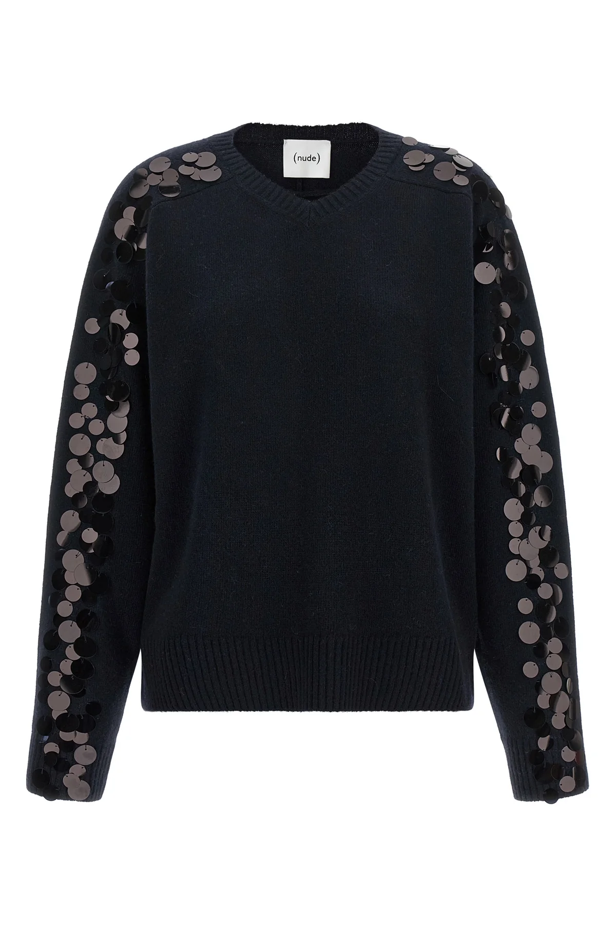 the nude knit redefines contemporary knitwear through a bold material contrast