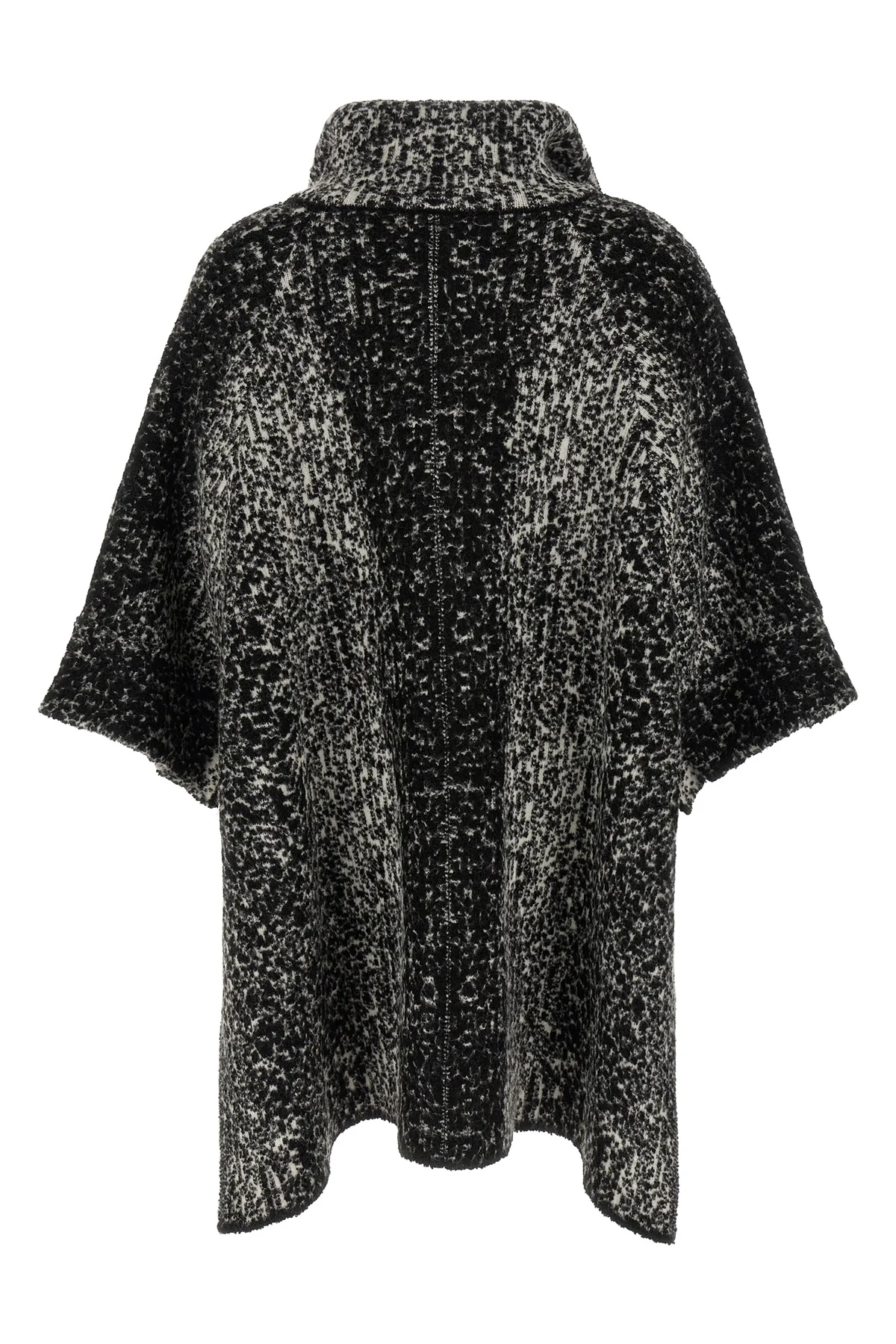 the nude knit coat redefines the volumes of contemporary outerwear through a cap