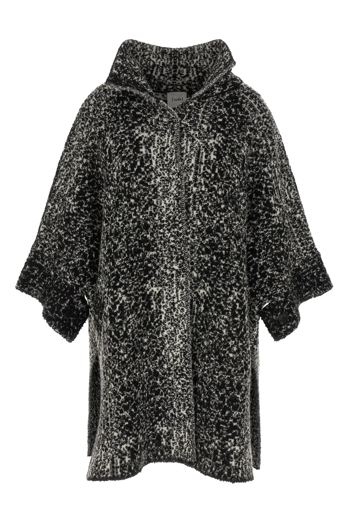 the nude knit coat redefines the volumes of contemporary outerwear through a cap
