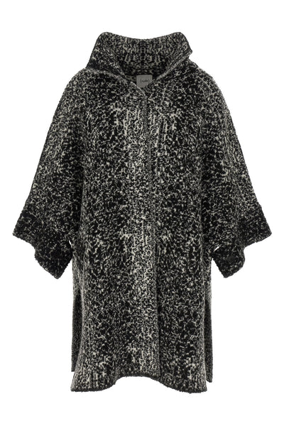 the nude knit coat redefines the volumes of contemporary outerwear through a cap