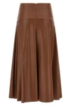 the midi skirt nude redefines the volumes of the contemporary wardrobe through a