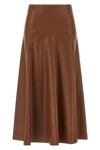 the midi skirt nude redefines the volumes of the contemporary wardrobe through a