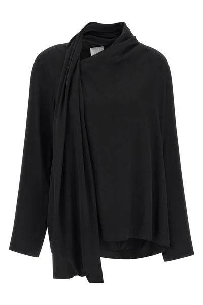 the nude blouse is distinguished by a sartorial construction focused on volume a