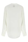 the nude blouse is distinguished by a fluid and deconstructed silhouette