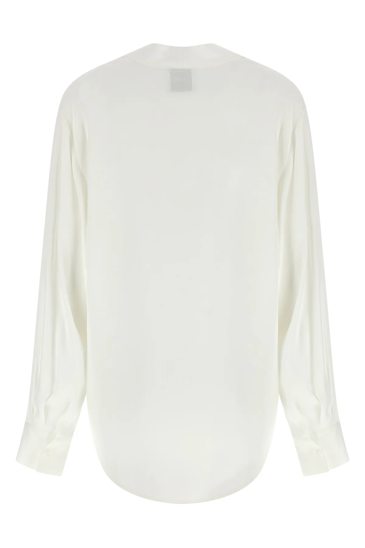 the nude blouse is distinguished by a fluid and deconstructed silhouette