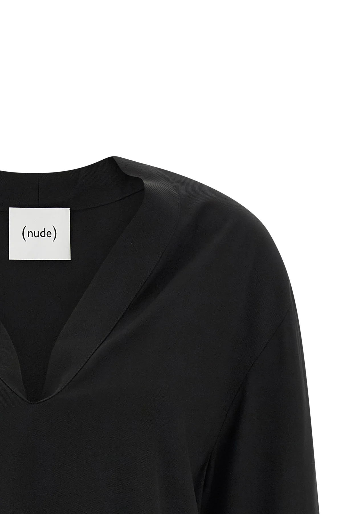 (nudes) long-sleeved blouse redefines minimalist elegance through a fluid silho