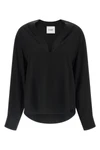 (nudes) long-sleeved blouse redefines minimalist elegance through a fluid silho