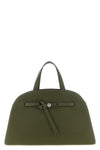 tory burchs romy top case handbag has a curved and structured silhouette