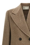 the tory burch coat defines a new concept of outerwear through sartorial volumes