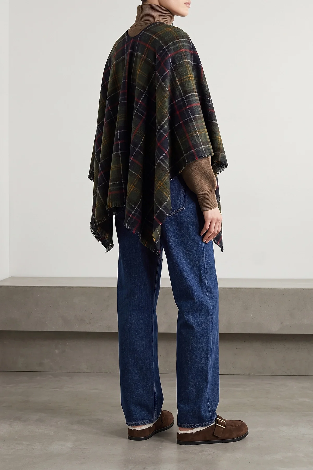 the prada sabot redefines informal luxury through a meticulous slip-on silhouett