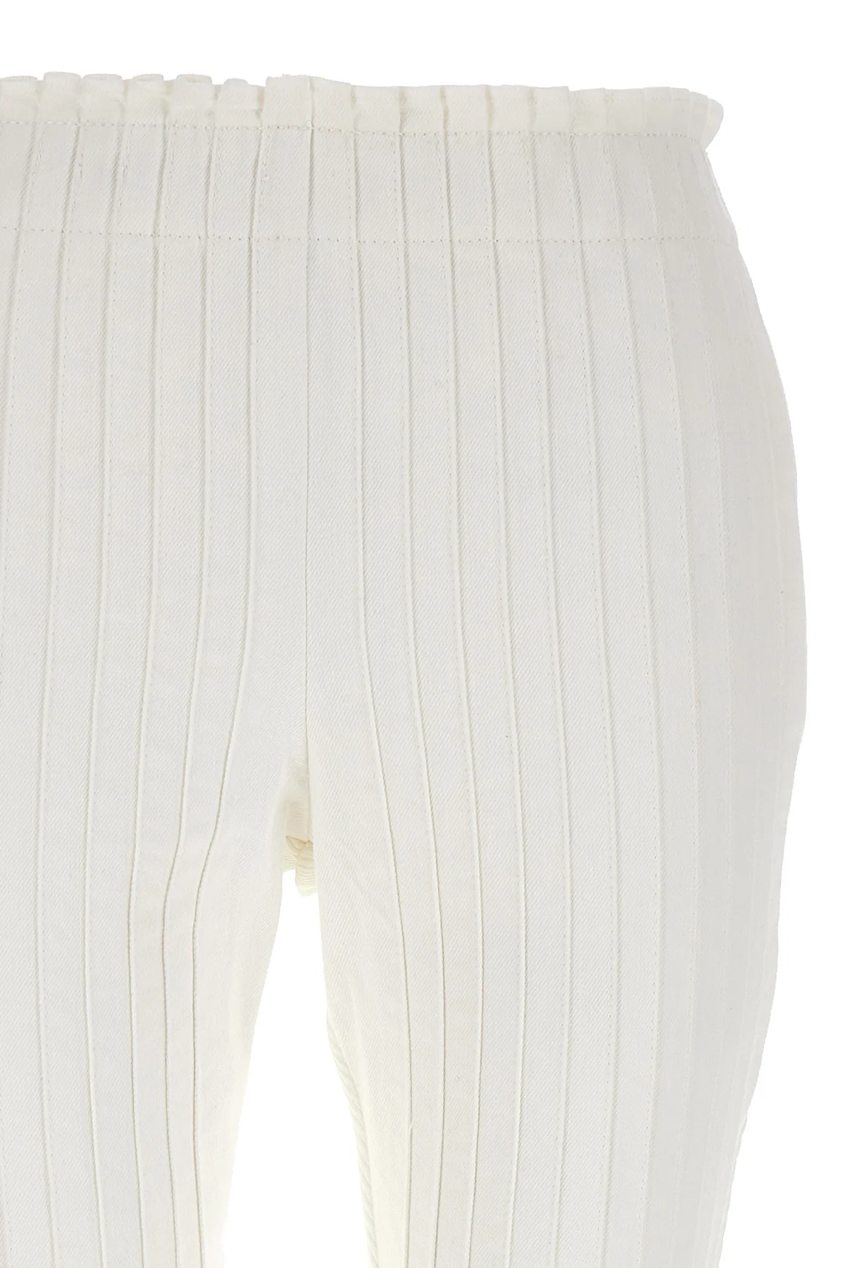 pleated cotton pants at the front and ribbed pants at the back