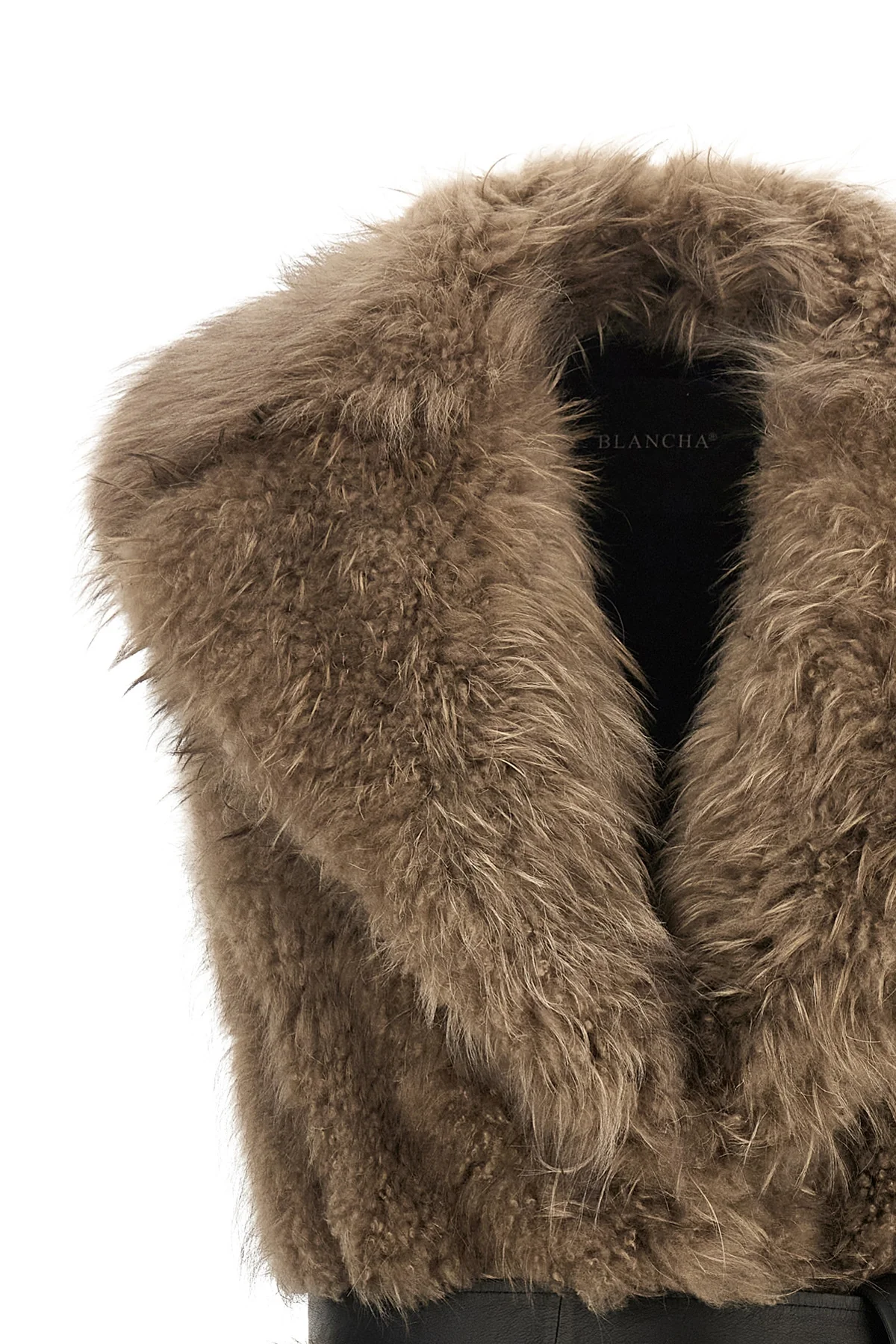 the blancha tipping goat cashmere vest is made of long-haired shearling in a n