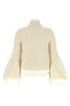 the sacai wool knit blouson exemplifies the brands distinctive hybrid construct