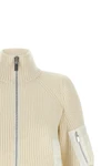 the sacai wool knit blouson exemplifies the brands distinctive hybrid construct
