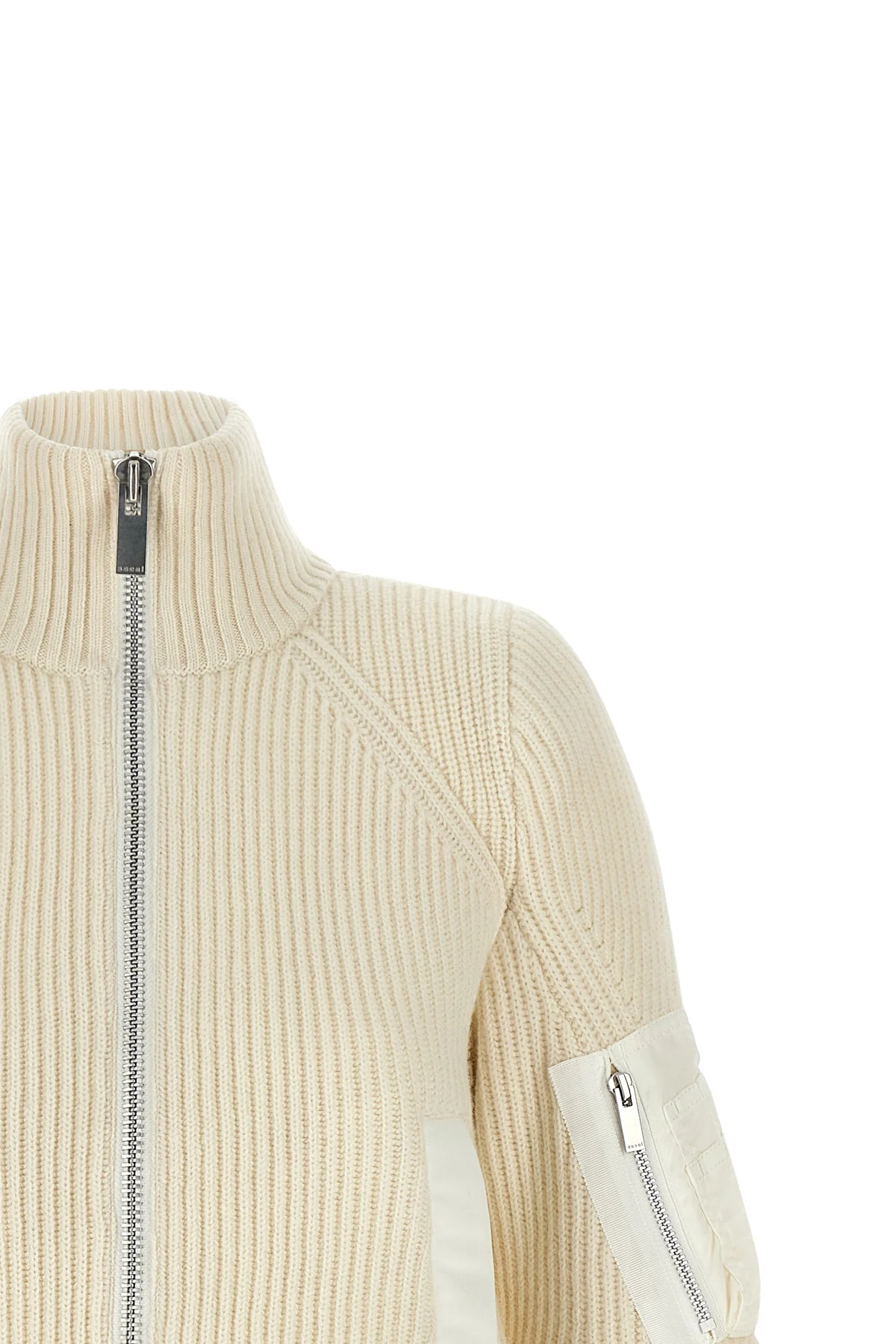 the sacai wool knit blouson exemplifies the brands distinctive hybrid construct