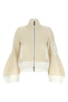 the sacai wool knit blouson exemplifies the brands distinctive hybrid construct