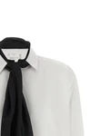 the sacai shirt redefines the codes of classic tailoring through a hybrid and de