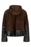 the sacai leather jacket redefines utilitarian outerwear through a masterful con