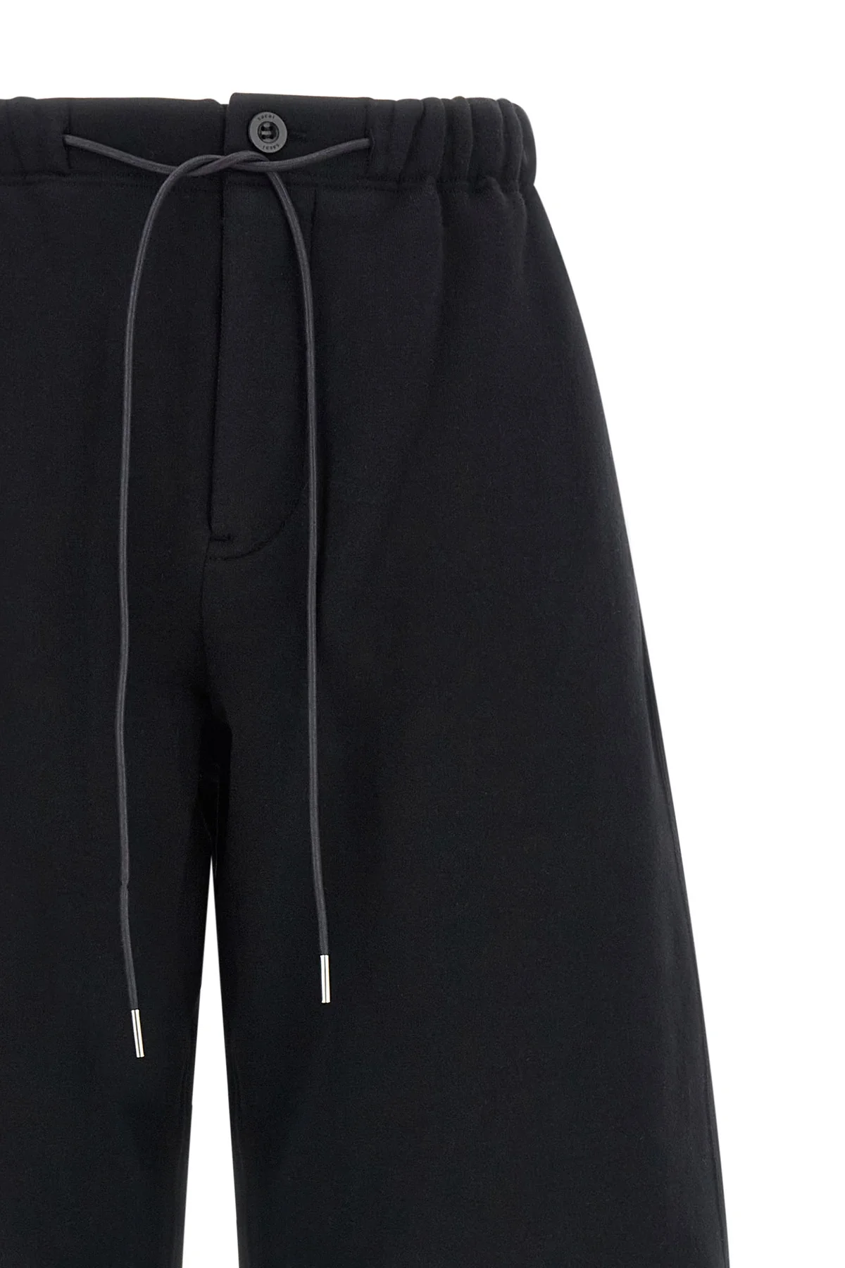 the sacai pants in pure cotton jersey redefine the codes of casual dress through