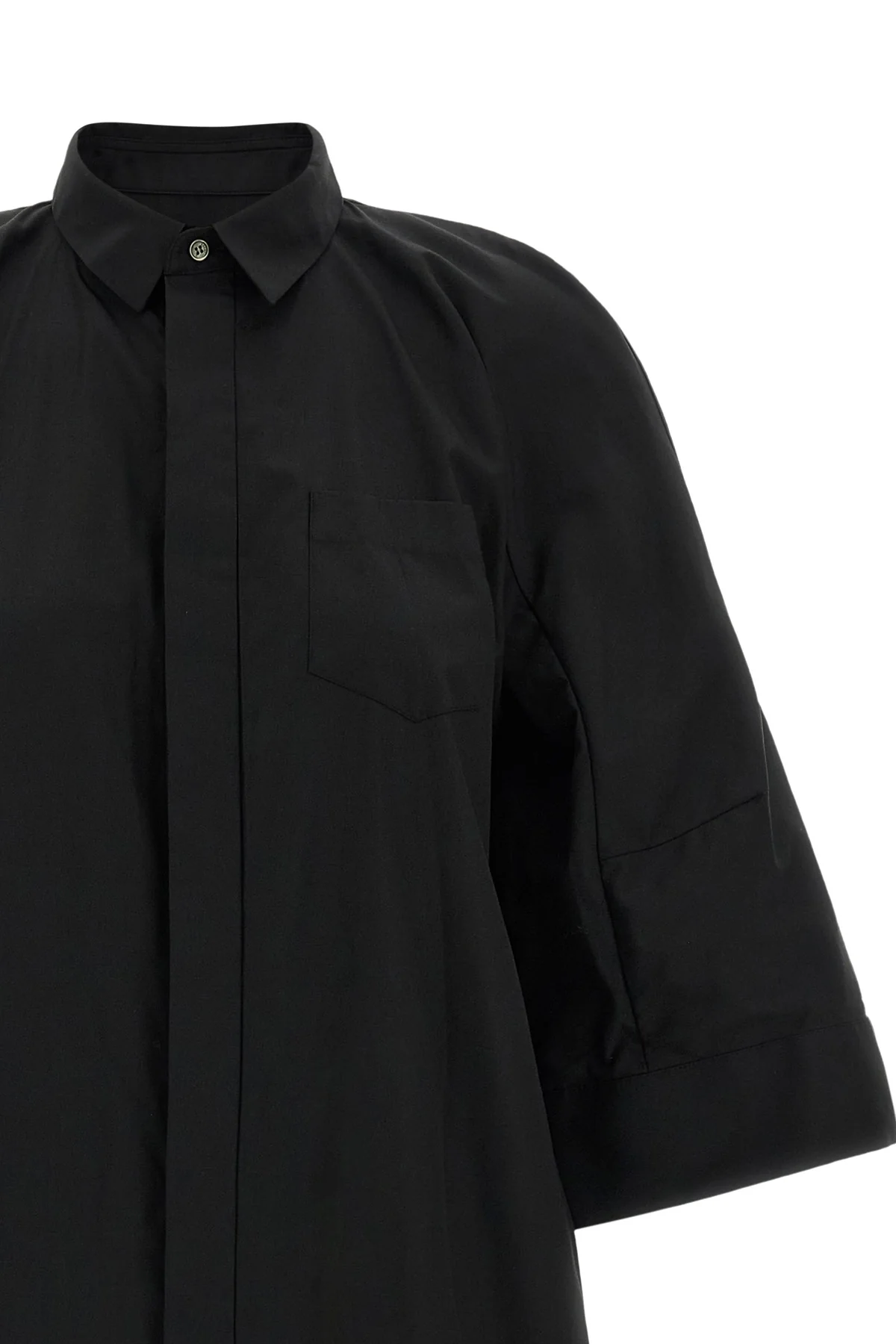 the sacai shirt dress redefines the codes of contemporary tailoring through unex