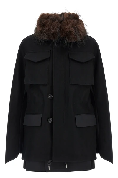 the sacai black jacket redefines the codes of outerwear through a complex hybrid