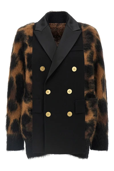 the sacai cardigan redefines knitwear codes through a complex hybrid constructio