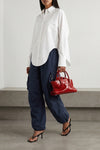 the attico la passeggiata mini handbag redefines classic volumes through a scu