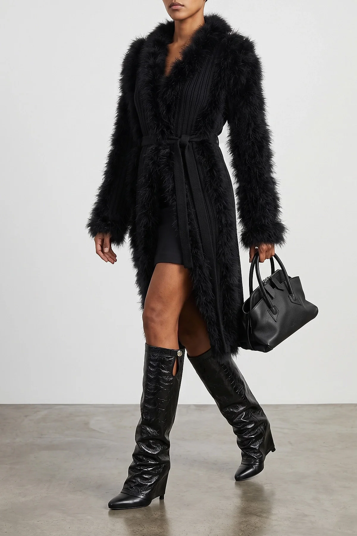 the attico long coat redefines the codes of knitwear through scenographic volume