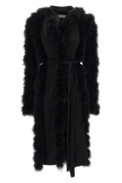 the attico long coat redefines the codes of knitwear through scenographic volume