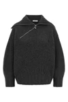 the the attico sweater redefines knitwear codes through a structured silhouette