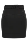 the attico mini skirt defines a sculptural and decisive silhouette through rigor