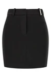 the attico mini skirt defines a sculptural and decisive silhouette through rigor