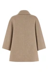 the max mara ospite cape redefines the volumes of outerwear through a flared sil