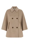 the max mara ospite cape redefines the volumes of outerwear through a flared sil