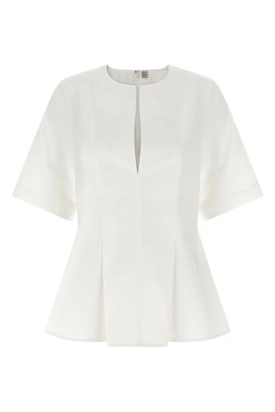 the toteme tailored top establishes a precise sartorial foundation through its