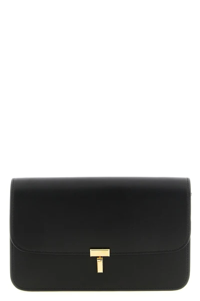 the toteme t-lock leather crossbody bag stands out for a structured construction
