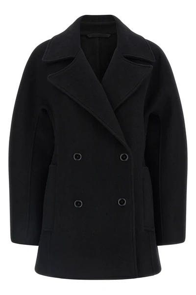 the toteme rounded peacoat coat redefines the outerwear through precise architec