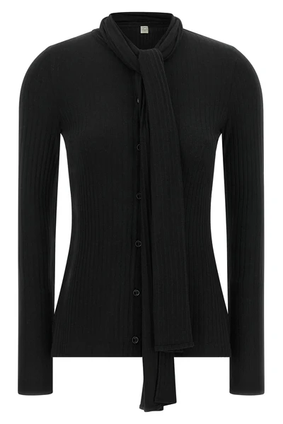 the toteme cardigan redefines everyday elegance through an essential silhouette