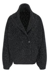 the toteme cardigan redefines the volumes of knitwear through a sculptural and e
