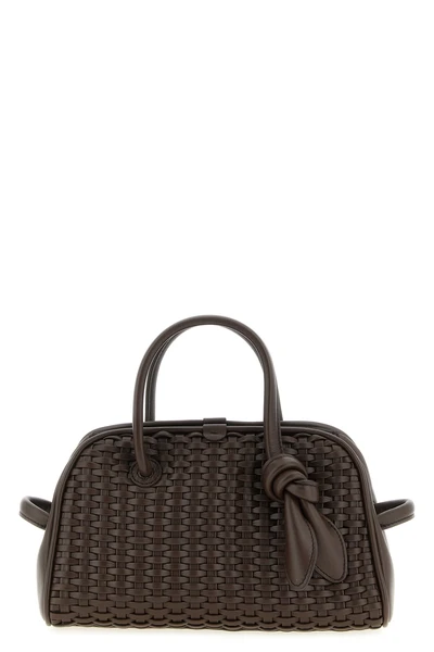 le petit turismo bowling handbag woven suede