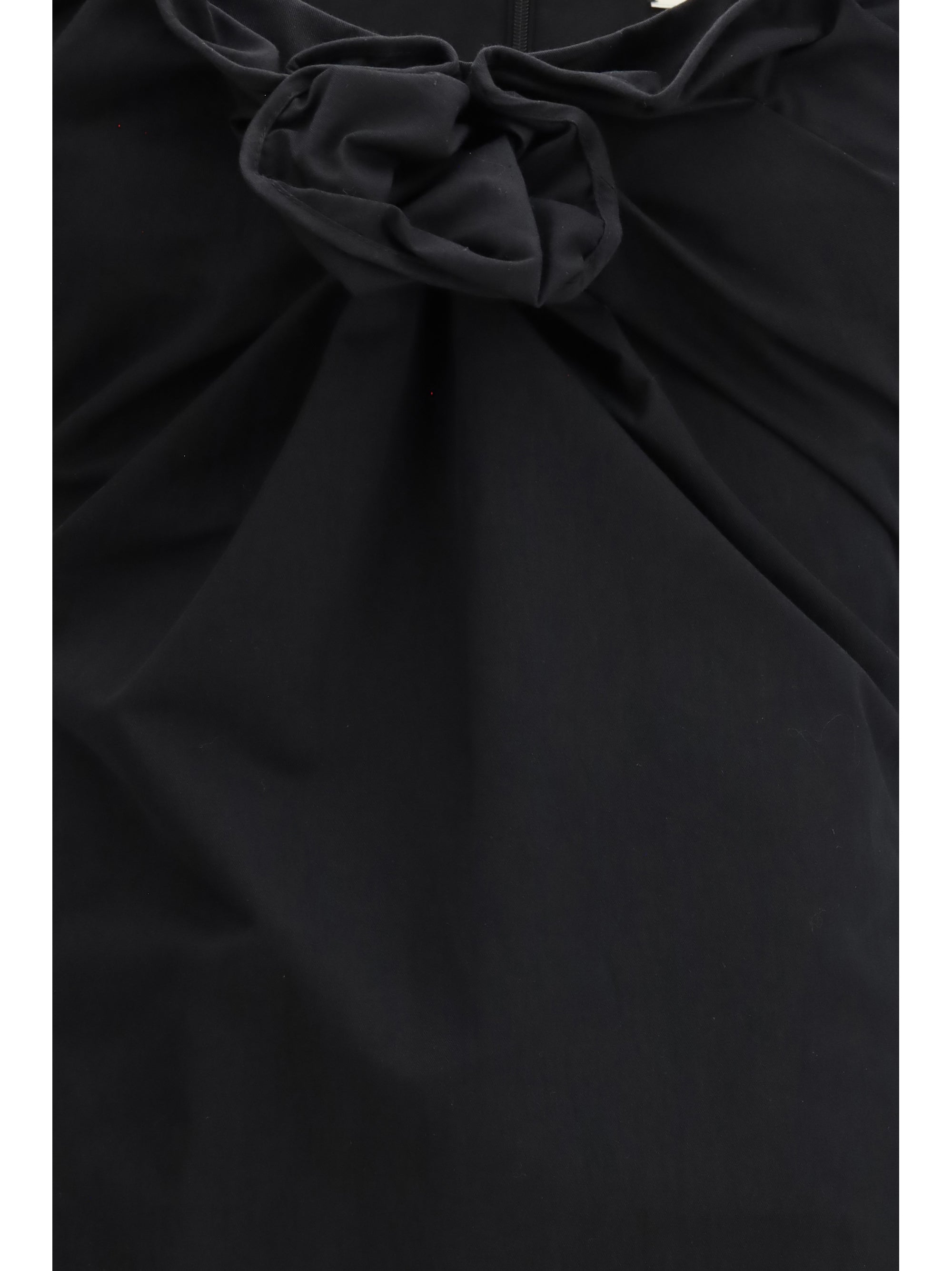 sleeveless dress with a draped neckline