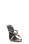 christian louboutin mulazee cross sandals redefine the slip-on silhouette thro