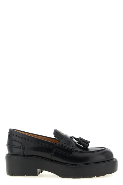 miu miu loafers in fine black calf leather reinterpret a wardrobe classic throug
