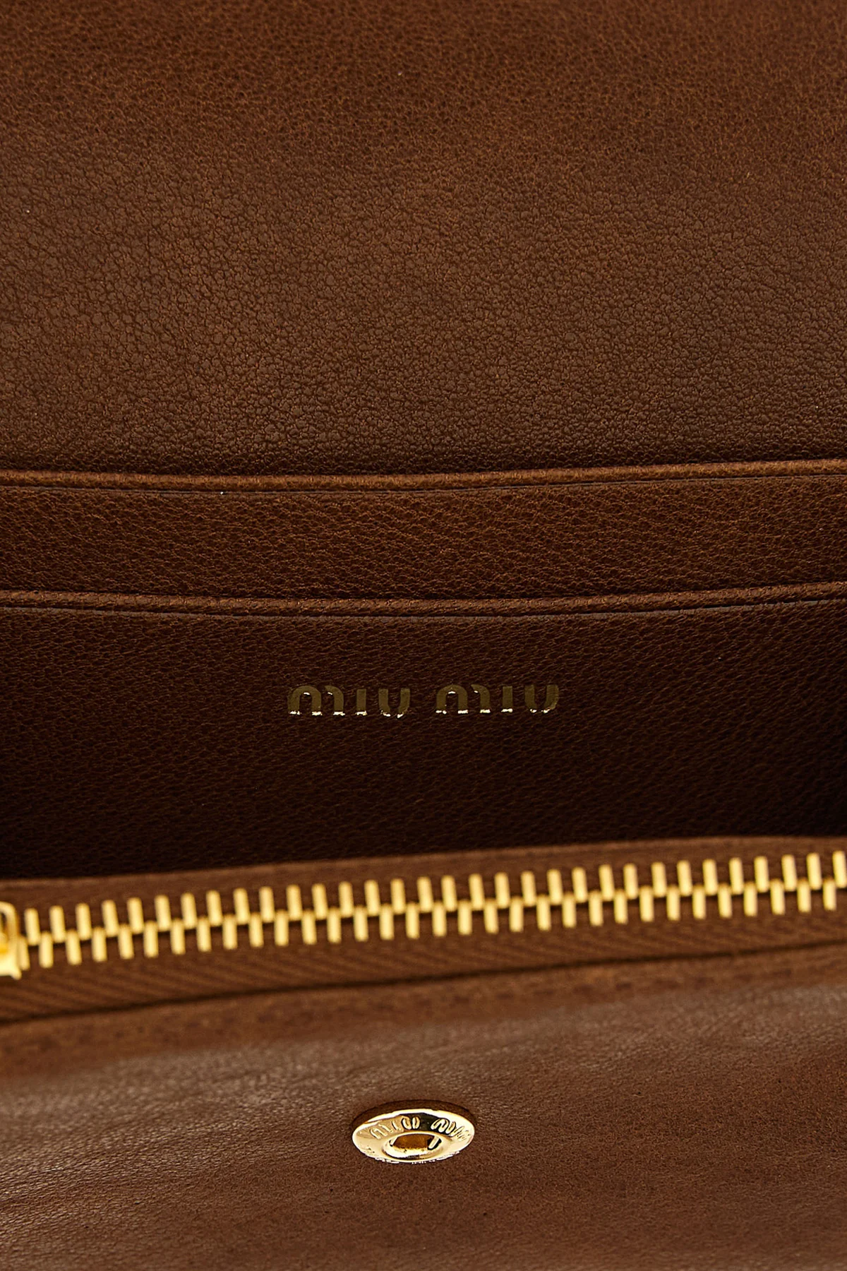 the miu miu small wallet in soft lambskin leather stands out for its compact and